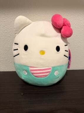 Squishmallows Hello Kitty 8" Plush Teal Overalls with Pink Striped Shirt